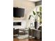 Stylish living room featuring a modern fireplace, sleek furniture, and large windows offering natural light at 1242 Wild Creek Ne Trl, Atlanta, GA 30324