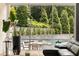 Living room with walls of windows overlooking a pool and landscaped yard at 1242 Wild Creek Ne Trl, Atlanta, GA 30324