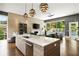 Open-concept living room with island and large windows offering bright natural light and views at 1242 Wild Creek Ne Trl, Atlanta, GA 30324