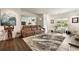 Modern living room featuring a plush brown leather sofa, artistic decor, and stylish, contemporary furnishings at 1242 Wild Creek Ne Trl, Atlanta, GA 30324