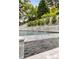 Beautiful pool with cascading water feature and lush landscaping at 1242 Wild Creek Ne Trl, Atlanta, GA 30324