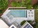 Aerial view of a stunning pool with a spa, dining area, and multiple seating options, perfect for relaxation at 1242 Wild Creek Ne Trl, Atlanta, GA 30324