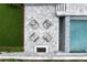 Overhead shot of cozy outdoor seating surrounding a fireplace by the pool, perfect for entertaining at 1242 Wild Creek Ne Trl, Atlanta, GA 30324