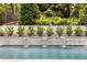 Stunning pool and cascading waterfall feature, accented by lush landscaping at 1242 Wild Creek Ne Trl, Atlanta, GA 30324