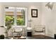 Bright sitting area with modern chairs, a view to the outside, and elegant decor, creating a calm atmosphere at 1242 Wild Creek Ne Trl, Atlanta, GA 30324