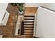Modern staircase featuring wooden steps, glass railings, and stylish design at 1242 Wild Creek Ne Trl, Atlanta, GA 30324