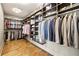 Spacious walk-in closet with custom shelving and hanging storage for organization at 1242 Wild Creek Ne Trl, Atlanta, GA 30324