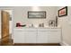 Contemporary wet bar featuring sleek white cabinets, a sink, and elegant decor at 1242 Wild Creek Ne Trl, Atlanta, GA 30324