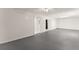 Unfinished basement with finished ceiling, floors, and doorways on either side of a support wall at 130 Timber Oak Cv, Lawrenceville, GA 30043