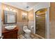 Bathroom with earth tone walls, a stand-up shower with glass door and a unique sink and vanity at 130 Timber Oak Cv, Lawrenceville, GA 30043