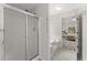 Bathroom featuring walk-in shower, soaking tub, and open doorway to bedroom at 130 Timber Oak Cv, Lawrenceville, GA 30043