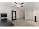 Bedroom with a ceiling fan, luxury vinyl plank flooring, and an accent rug at 130 Timber Oak Cv, Lawrenceville, GA 30043