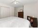 Bedroom featuring a ceiling fan, luxury vinyl plank flooring, and a double closet at 130 Timber Oak Cv, Lawrenceville, GA 30043
