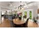 Open dining area with a chandelier, bay windows, and a seamless flow to the kitchen at 130 Timber Oak Cv, Lawrenceville, GA 30043