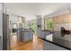 Kitchen features gray cabinets, granite counters and stainless steel appliances including a large refrigerator at 130 Timber Oak Cv, Lawrenceville, GA 30043