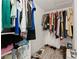 Well-organized walk-in closet offers ample hanging space, shelving, and room for shoes at 130 Timber Oak Cv, Lawrenceville, GA 30043