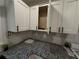 Close-up of kitchen with white cabinets, granite countertops, and modern hardware at 186 W Lake Nw Dr, Atlanta, GA 30314