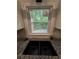 Kitchen showcasing granite countertops and a double basin sink beneath a bright window at 186 W Lake Nw Dr, Atlanta, GA 30314