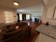 Open-concept living space with hardwood floors and a cozy fireplace at 186 W Lake Nw Dr, Atlanta, GA 30314