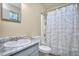Bathroom with shower, tub, and marble countertop sink at 2066 Tidwell Trl, Stone Mountain, GA 30088