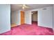 Carpeted bedroom featuring neutral walls, and a ceiling fan with ample natural light at 2066 Tidwell Trl, Stone Mountain, GA 30088