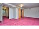 Carpeted bedroom featuring neutral walls, and a ceiling fan with ample natural light at 2066 Tidwell Trl, Stone Mountain, GA 30088