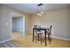 Cozy dining area features modern lighting and table for four at 2066 Tidwell Trl, Stone Mountain, GA 30088
