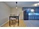 Dining area adjacent to kitchen featuring modern pendant lighting and seating at 2066 Tidwell Trl, Stone Mountain, GA 30088