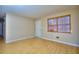 Bright living room with natural light, featuring hardwood floors and neutral-colored walls at 2066 Tidwell Trl, Stone Mountain, GA 30088