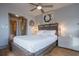 Comfortable bedroom with a soft bed, sliding door closet, and artistic decor at 215 Piedmont Ne Ave # 804, Atlanta, GA 30308