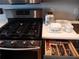 Modern kitchen featuring a stainless steel range, toaster and organized utensils at 215 Piedmont Ne Ave # 804, Atlanta, GA 30308