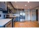 Modern kitchen featuring stainless steel appliances, light countertops, gray cabinets, and wood floors at 215 Piedmont Ne Ave # 804, Atlanta, GA 30308