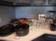 Functional kitchen counter with coffee maker, blender, pans, and glassware at 215 Piedmont Ne Ave # 804, Atlanta, GA 30308