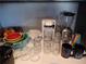 Well-organized kitchen counter featuring a coffee maker, blender, glasses, and mugs at 215 Piedmont Ne Ave # 804, Atlanta, GA 30308