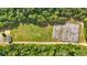 Aerial view of a community sports field, including a soccer field and basketball courts at 3 Windsor Ct, Kingston, GA 30145