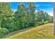 Large backyard with mature trees at 3 Windsor Ct, Kingston, GA 30145
