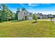 A charming home with a manicured lawn under a clear blue sky at 3 Windsor Ct, Kingston, GA 30145
