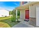 Inviting front porch and red door enhance the curb appeal of this well-maintained home at 3 Windsor Ct, Kingston, GA 30145