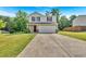 Two-story home featuring a two-car garage and a well-maintained front lawn at 3 Windsor Ct, Kingston, GA 30145