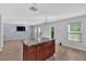The spacious kitchen features wood cabinets, an island, and modern appliances at 3 Windsor Ct, Kingston, GA 30145