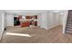 Inviting living space with kitchen island, sleek appliances, and easy access to stairs at 3 Windsor Ct, Kingston, GA 30145
