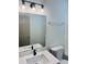 Bathroom featuring Quartz vanity with modern lighting and fixtures at 415 Dove Ln, Social Circle, GA 30025