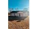 Home with a black roof, beige siding, and medium sized backyard at 415 Dove Ln, Social Circle, GA 30025