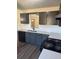 Modern kitchen features sleek gray cabinets, stainless steel appliances, and Quartz countertops at 415 Dove Ln, Social Circle, GA 30025