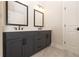 Modern bathroom featuring a double vanity with sleek black fixtures and hardware at 530 Fisher Dr # 45, Alpharetta, GA 30009