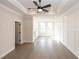 Large primary bedroom with hardwood floors, ceiling fan and an abundance of natural light at 530 Fisher Dr # 45, Alpharetta, GA 30009
