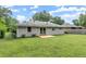 Expansive backyard featuring a freshly painted exterior and a new wooden deck, ideal for outdoor entertaining and relaxation at 2756 Gresham Se Rd, Atlanta, GA 30316