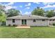 Grassy backyard view highlighting the home's freshly painted exterior and wooden deck, perfect for outdoor enjoyment at 2756 Gresham Se Rd, Atlanta, GA 30316