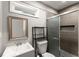 Bathroom featuring tiled walk-in shower, modern vanity, and stylish fixtures at 2756 Gresham Se Rd, Atlanta, GA 30316