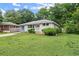 Attractive one-story home featuring a well-manicured lawn, beautiful landscaping, and a charming front porch at 2756 Gresham Se Rd, Atlanta, GA 30316